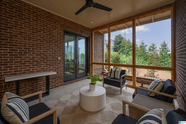 sunroom with wooden ceiling and ceiling fan