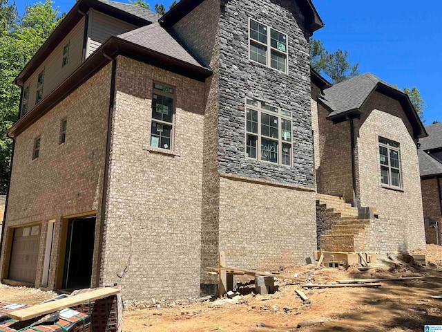 view of side of home with a garage