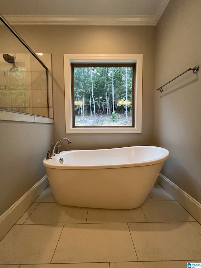 bathroom with tile patterned flooring, ornamental molding, and shower with separate bathtub