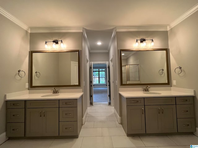 bathroom featuring tile patterned flooring, vanity, and ornamental molding