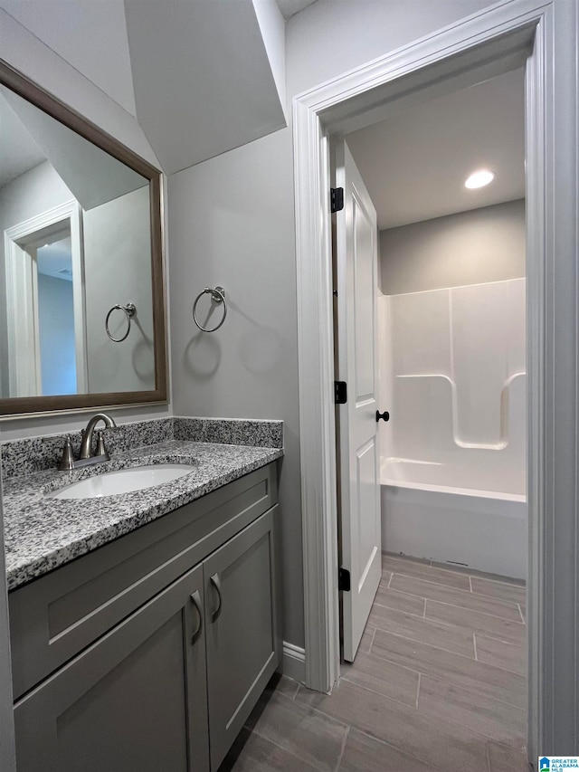 bathroom with vanity and shower / bathtub combination