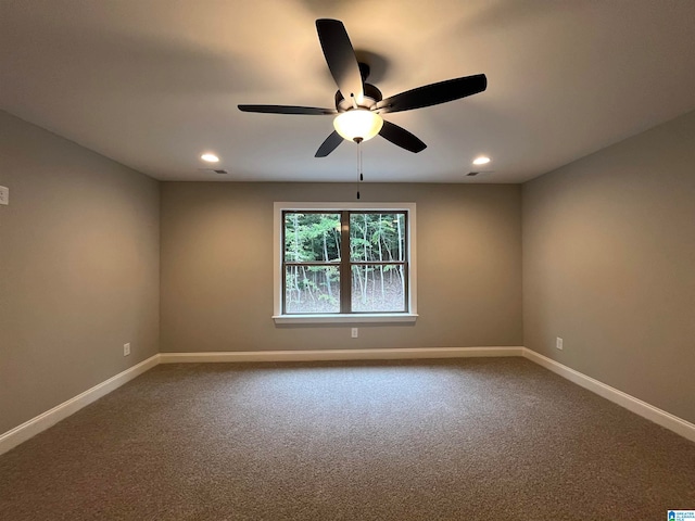 unfurnished room with ceiling fan and carpet floors