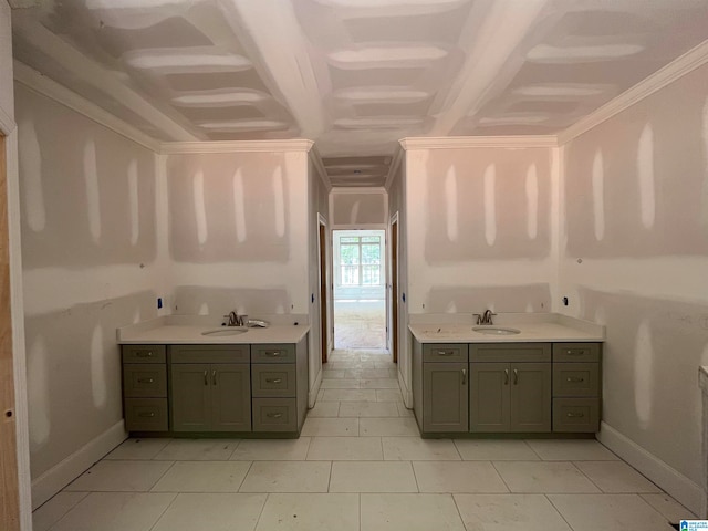 kitchen featuring light tile patterned flooring, ornamental molding, and sink