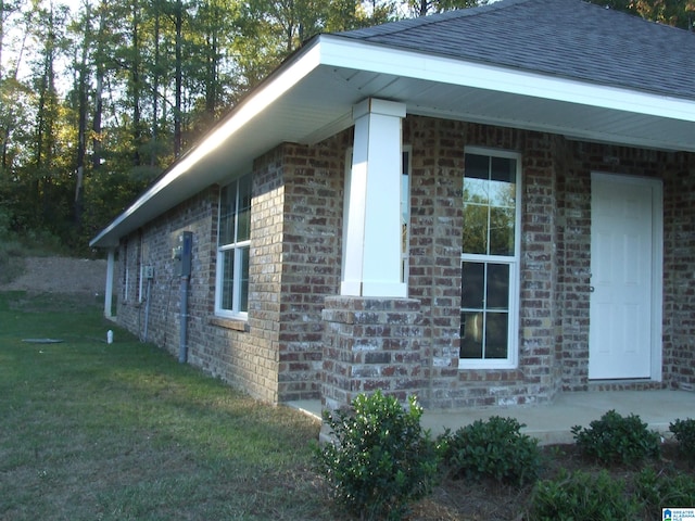 view of property exterior featuring a lawn