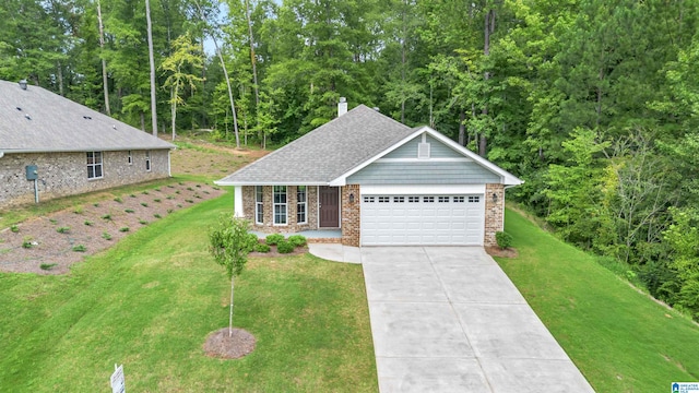 view of front of property with a garage and a front lawn