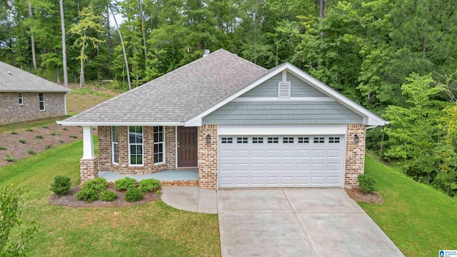 craftsman house featuring a garage and a front yard