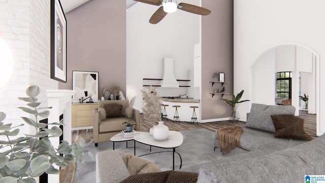 living room with ceiling fan, wood-type flooring, and high vaulted ceiling