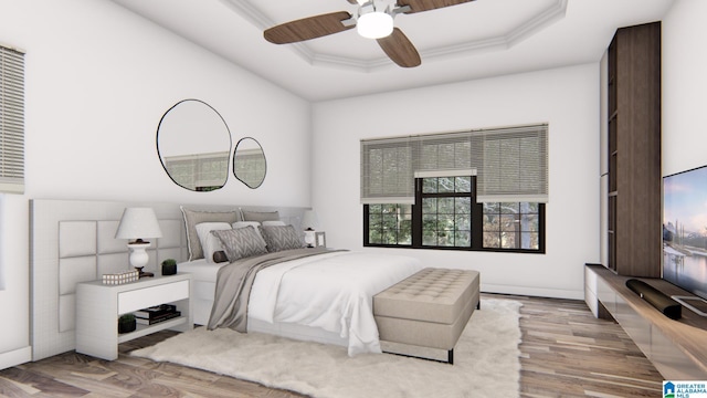 bedroom featuring a raised ceiling, light hardwood / wood-style flooring, ceiling fan, and crown molding