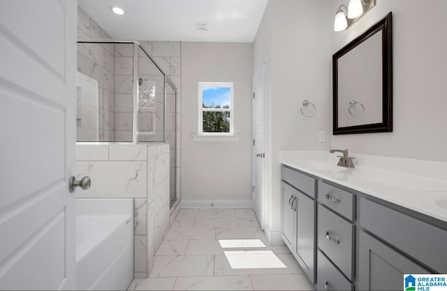 bathroom featuring plus walk in shower and vanity