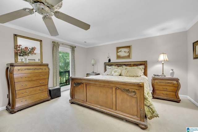 carpeted bedroom featuring ceiling fan and ornamental molding