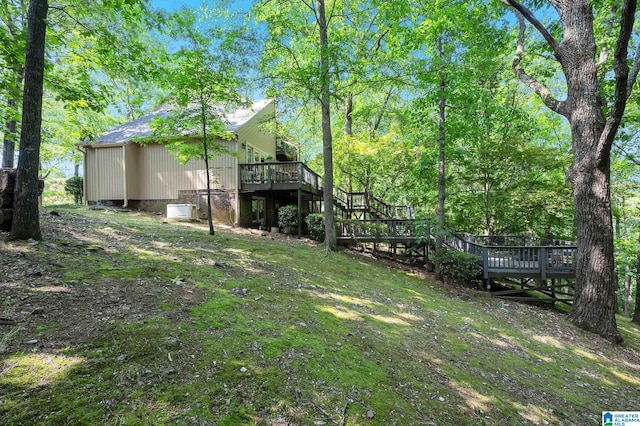 view of yard with a wooden deck