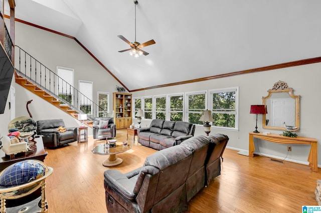 living room featuring ceiling fan, crown molding, high vaulted ceiling, and light hardwood / wood-style floors