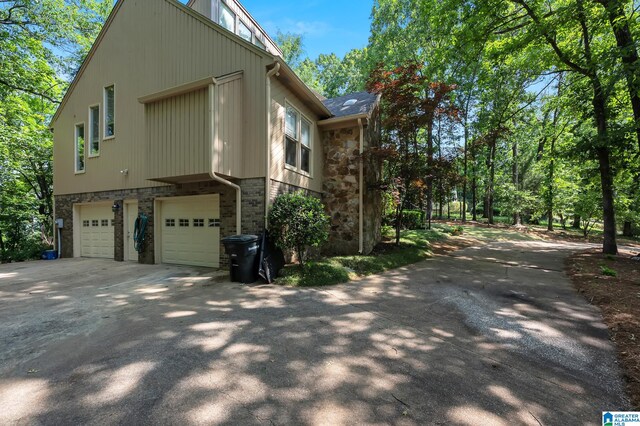 view of side of property with a garage