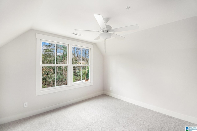 bonus room with vaulted ceiling, carpet floors, and ceiling fan