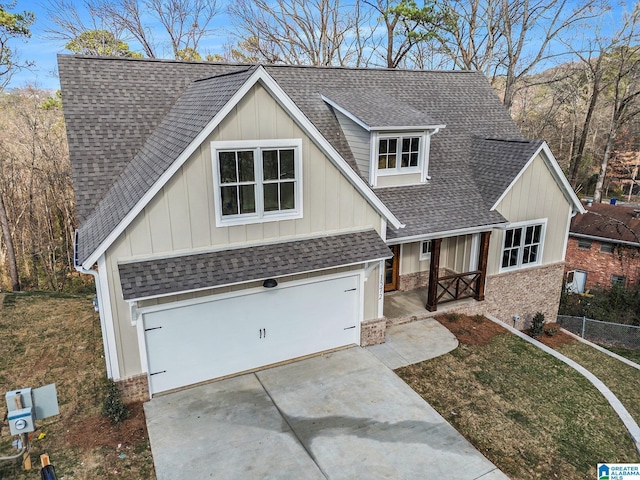 view of front of house with a garage and a front lawn