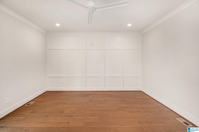 spare room with crown molding, wood-type flooring, and ceiling fan