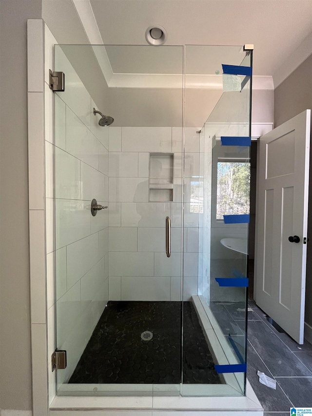 bathroom featuring tile flooring and walk in shower