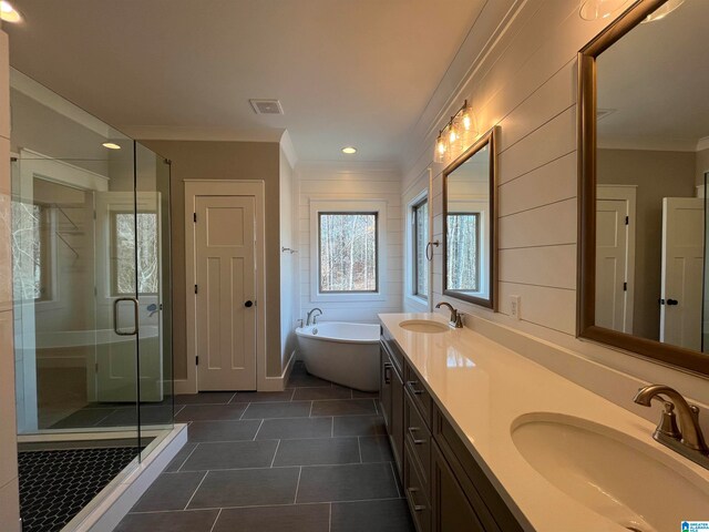 bathroom with shower with separate bathtub, tile floors, ornamental molding, and double vanity