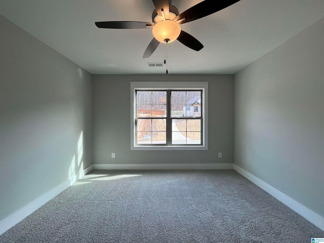 unfurnished room featuring ceiling fan and carpet floors