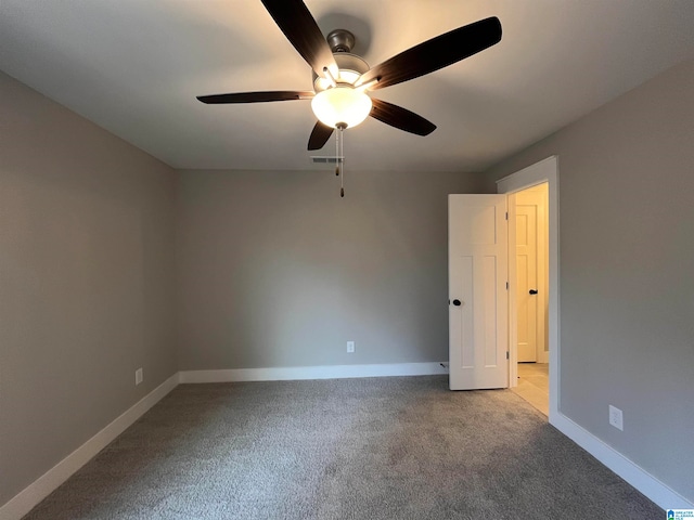 carpeted empty room with ceiling fan