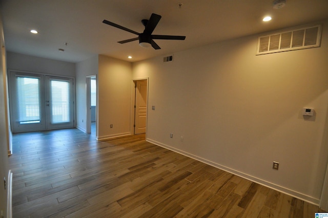 401 S 20th St Unit 420, Birmingham, AL 35233 - spare room featuring french doors, ceiling fan, and dark wood-type flooring