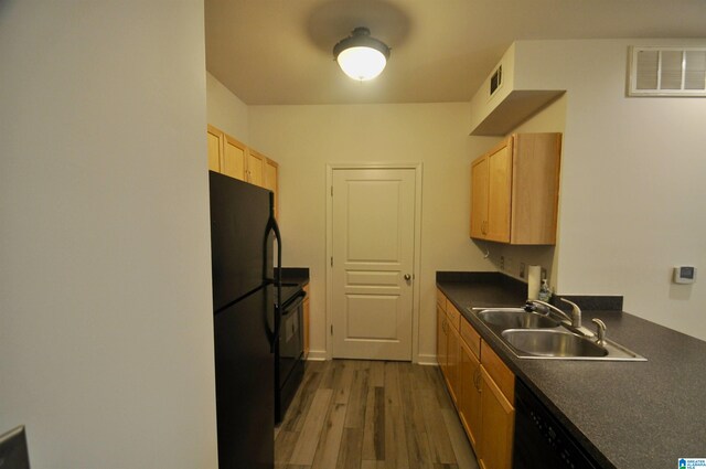 401 S 20th St Unit 420, Birmingham, AL 35233 - kitchen with dark hardwood / wood-style floors, sink, and black appliances