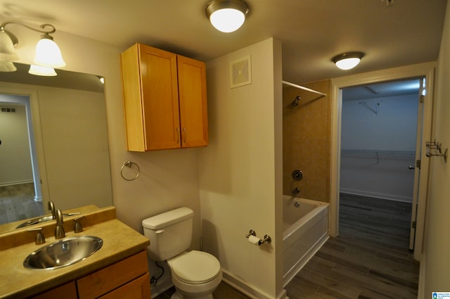 401 S 20th St Unit 420, Birmingham, AL 35233 - full bathroom with hardwood / wood-style flooring, tiled shower / bath combo, oversized vanity, and toilet