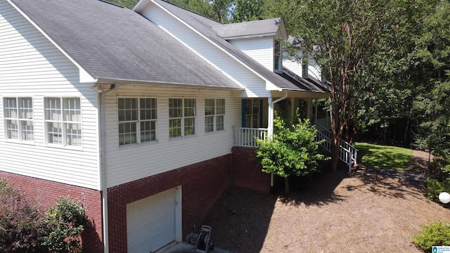 view of side of property with a garage