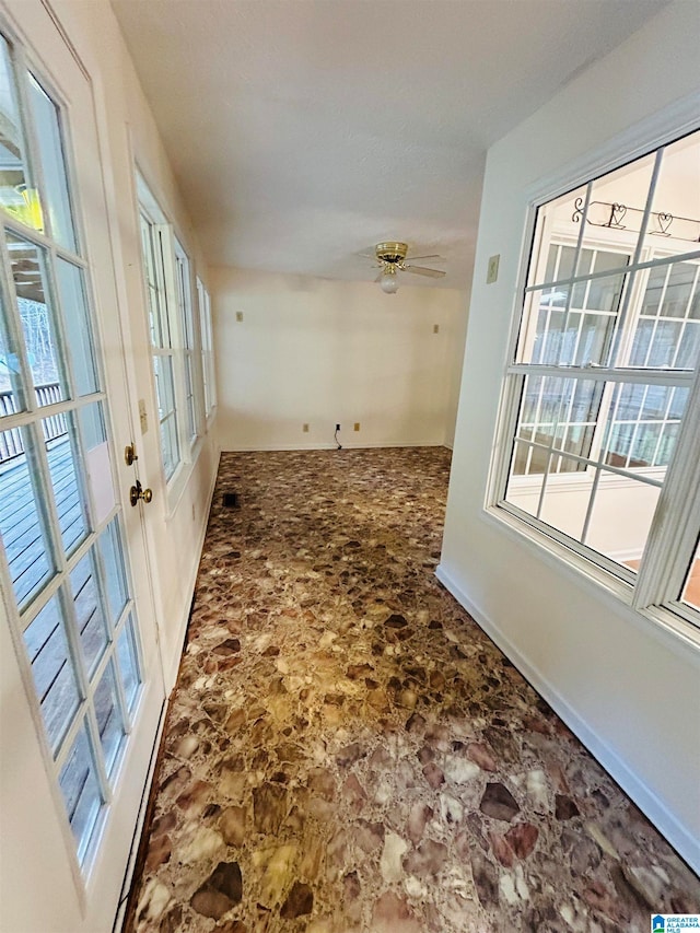 tiled entrance foyer with ceiling fan