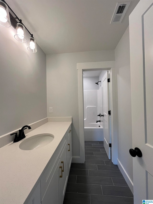 bathroom featuring vanity and bathtub / shower combination