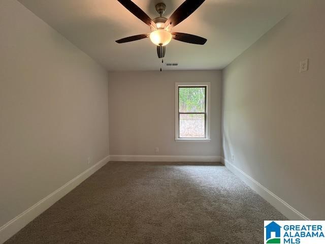 carpeted empty room with ceiling fan