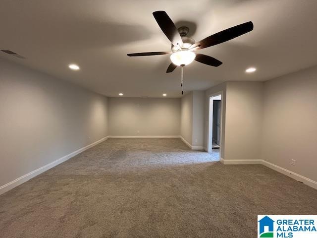 carpeted empty room with ceiling fan