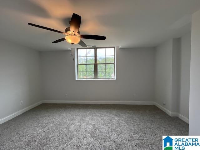 unfurnished room featuring carpet and ceiling fan