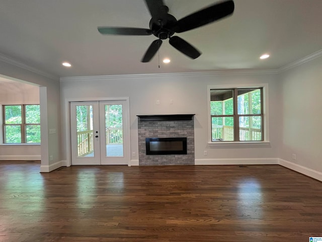 unfurnished living room featuring french doors, dark hardwood / wood-style floors, ceiling fan, and a healthy amount of sunlight