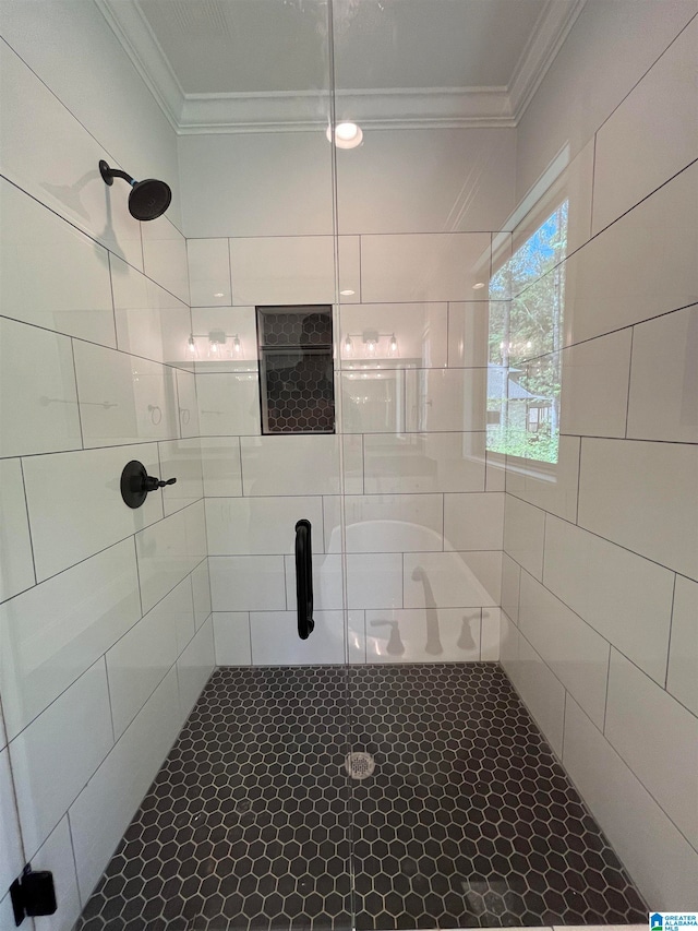 bathroom featuring walk in shower and ornamental molding