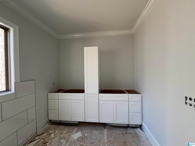 bathroom with crown molding and plenty of natural light