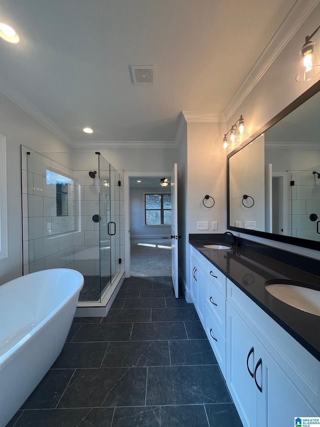 bathroom with plus walk in shower, vanity, tile patterned floors, and ornamental molding