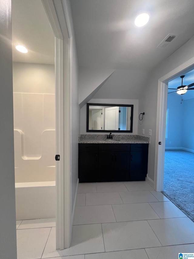 bathroom featuring tile patterned floors, ceiling fan, and vanity