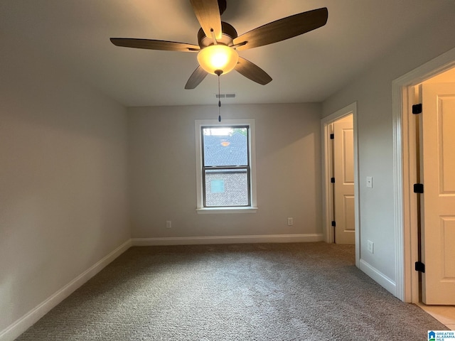 empty room featuring light carpet and ceiling fan