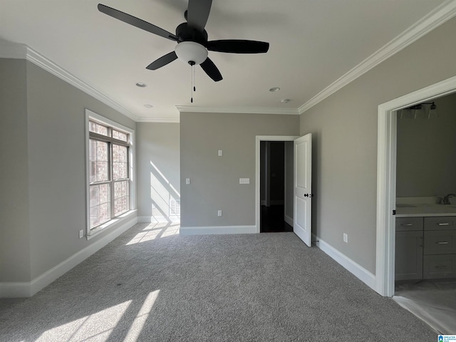 interior space with ceiling fan and ornamental molding