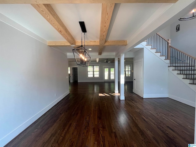 unfurnished dining area with ceiling fan, beam ceiling, and dark wood-type flooring