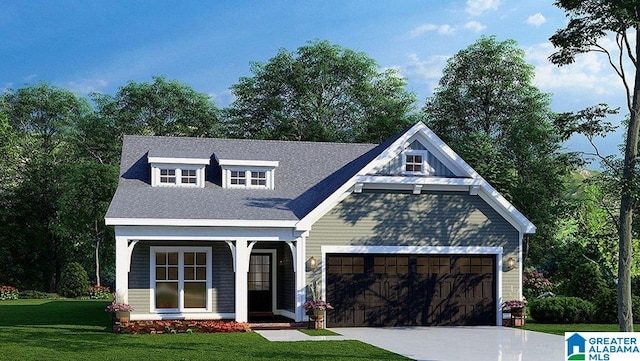 view of front of house featuring a garage and a front yard