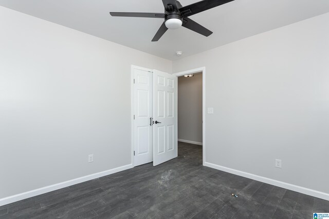 kitchen featuring ceiling fan, white cabinets, sink, dishwasher, and dark wood-type flooring