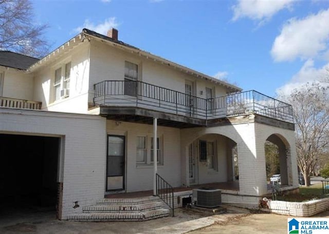 back of house featuring a balcony and central air condition unit