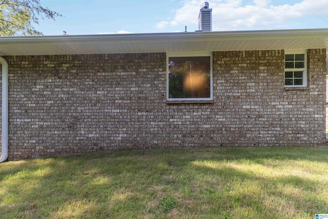 view of side of property with a yard