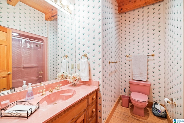 full bathroom featuring washtub / shower combination, toilet, vanity, and wood-type flooring