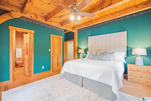 bedroom featuring connected bathroom, ceiling fan, wooden ceiling, beam ceiling, and light wood-type flooring