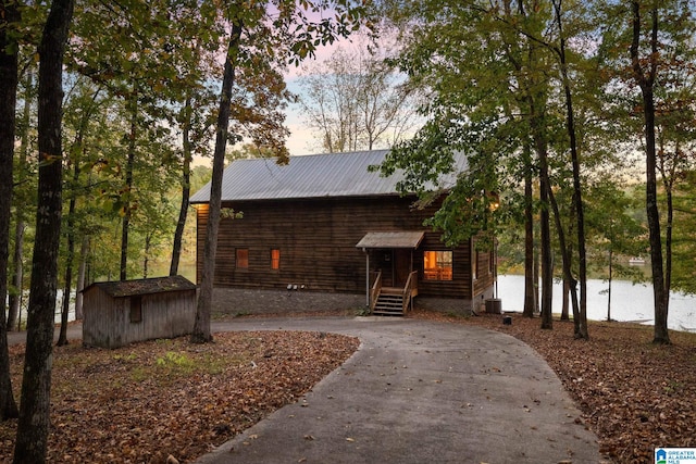 exterior space featuring a shed