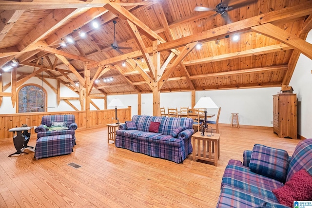 living room with wood ceiling, vaulted ceiling with beams, light hardwood / wood-style floors, and ceiling fan