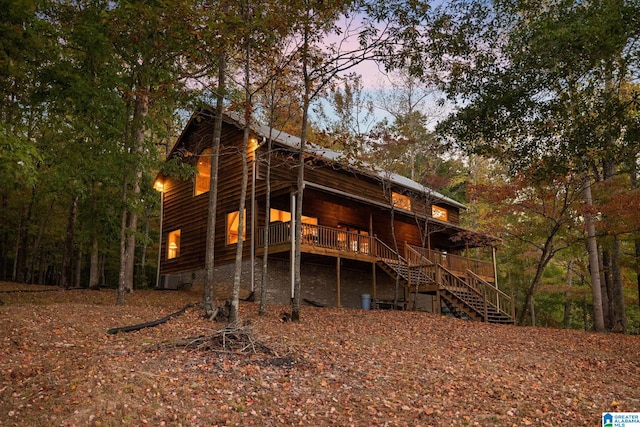 view of back house at dusk